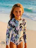  Beach days wearing our long-sleeve, full- front zip swimsuit with a colourful tropical toucan pattern in purple, blue, green, and black. UPF 50+